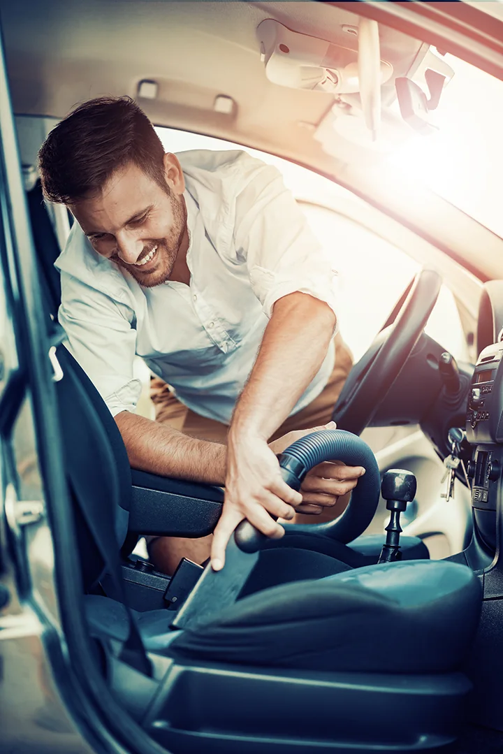 A Diamond Express Auto Wash team member greeting a customer at the pay station in Albuquerque, NM